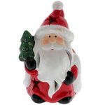 Santa Claus figurine with tree and lights