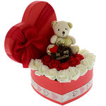 Arrangement with roses and a valentine bear