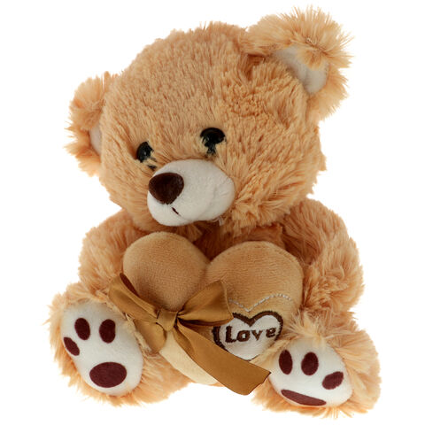 Brown teddy bear with a heart